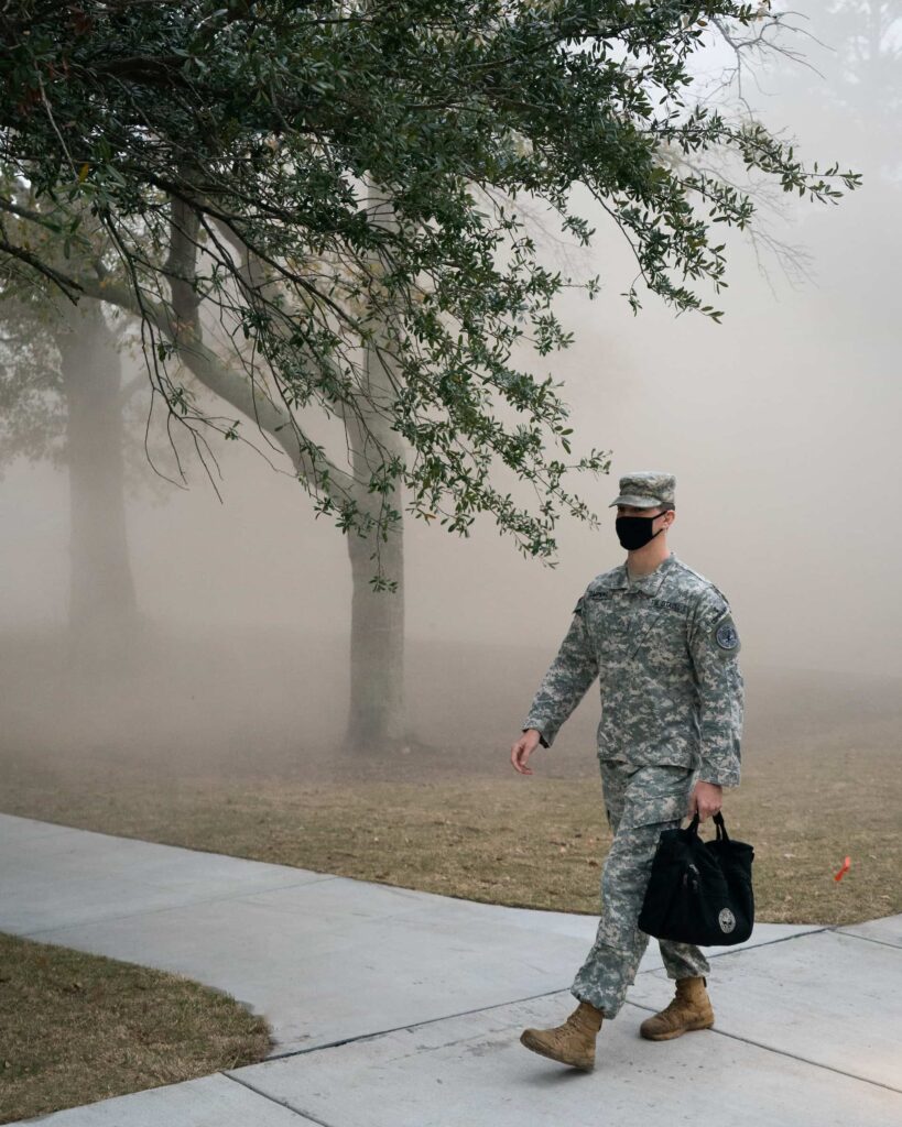 Cadet walking in fog outside Bastin Hall